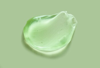 Liquid green gel cosmetic smudge texture transparent green background