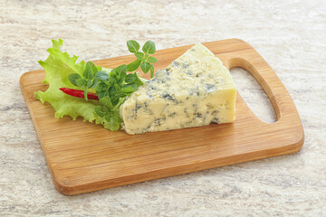 Blue cheese piece over board
