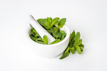 Aroma herbs for medicine and cooking. Mint leaves in mortar