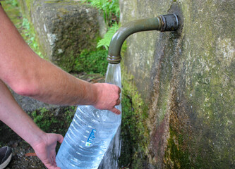 collecting water in a fountain due to shortage and restrictions