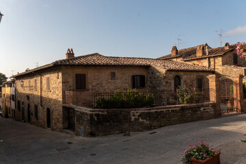 Fototapeta na wymiar A quiet street of residential buildings in the historic medieval village of Panzano Tuscany