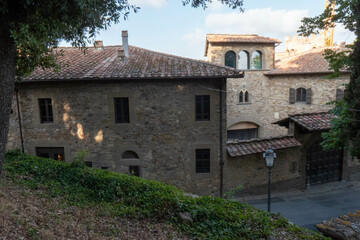 Fototapeta na wymiar A quiet street of residential buildings in the village of Panzano Tuscany