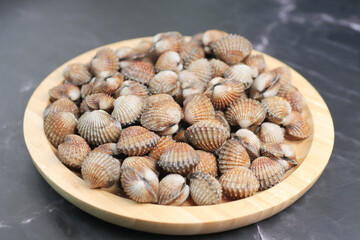 dolly shot of cockles on a plate 