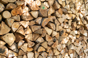 textured firewood background of chopped wood for kindling and heating the house