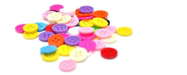 colorful various buttons on white background, soft and selective focus.