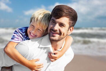 Shot of a man spending the day at the beach with his adorable child.