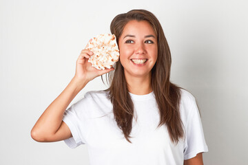 Woman with seashell against white background