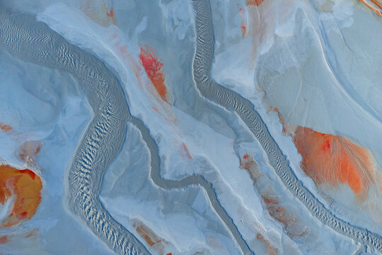 Colorful textures on sandy terrain at mine site in Huelva