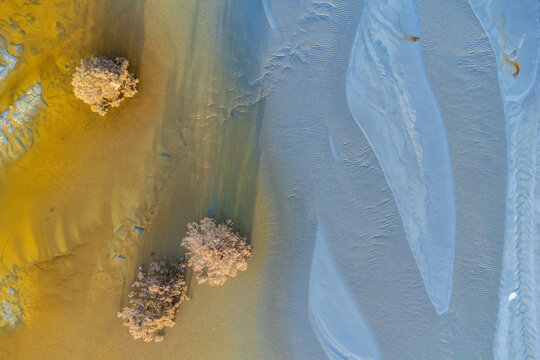 Colorful textures on sandy terrain at mine site in Huelva