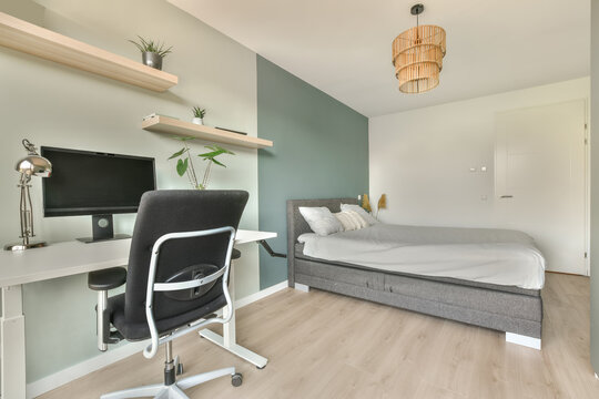 Comfortable bed with white walls
