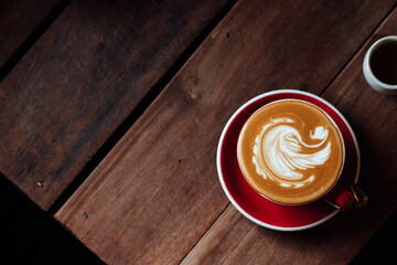 cup of coffee on wooden table