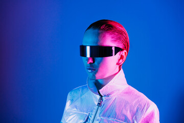 Neon portrait of woman, dressed in futuristic holographic clothes and glasses. Portrait of a...