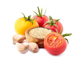 Fresh tomatoes  with  garlic  isolated on white background. Granulated garlic  in wooden bowl.