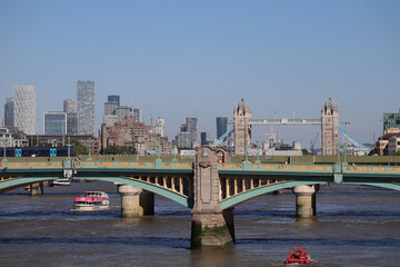 Obraz premium London, United Kingdom - 11.08.2022: Southwark Bridge in London and the Famous Tower Bridge seen behind