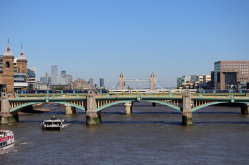 Fototapeta premium London, United Kingdom - 11.08.2022: Southwark Bridge in London and the Famous Tower Bridge seen behind