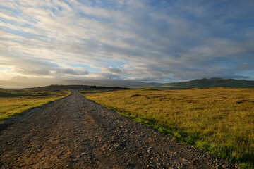 Fototapeta na wymiar landscape and lonely gravel road of South Iceland, view from peninsula Dyrhólaey back to the hills