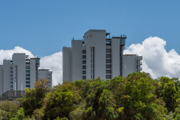 Garden of Troia covered with green trees andmodern buildings, Grandola municipality, Portugal