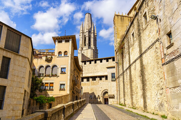 Fototapeta na wymiar Access street to the cathedral of Girona with old and stately buildings next to the church, Girona, Catalonia.