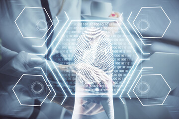 Double exposure of woman hands typing on computer and fingerprint drawing. Security concept.