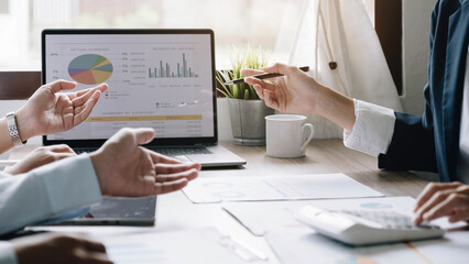 Business people using computer meeting to analyze and discuss the situation on the marketing data online in the meeting room.Business concept idea background.