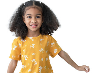Happy African little girl 4 years old with curly hair in yellow T shirt, smiling and looking at camera on white background