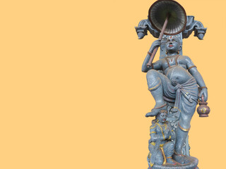 Vamana or Vamanadeva - Hindu God, Brahmin boy, dwarf with umbrella. Giant Indian temple statue....