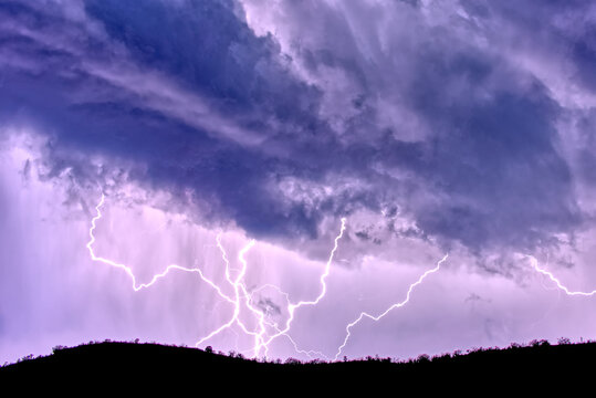 Lightning bolts striking the summit of Sullivan Butte in Chino Valley Arizona during the 2022 Monsoon season.