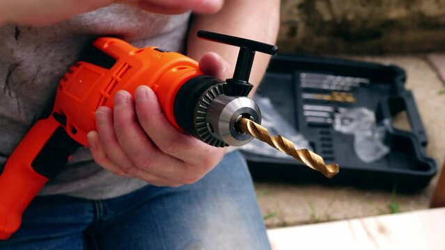 Fitting bit in electric power drill for diy 