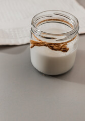 Glass jar with vegan milk. alternative dairy product. self care concept. healthy eating. no allergy, lactose free. close-up, selective focus