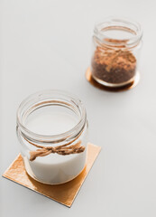Jar with vegan milk and buckwheat. Eco and animal friendly eating concept. Healthy food, diet. Lactose free. Soft focus. Copy space