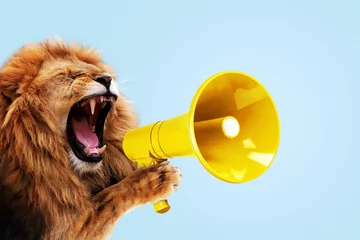 Gordijnen Cool beautiful lion holding and screaming into a yellow loudspeaker on a blue background. Business management and boss, a creative idea. Successful advertising and management, concept. Attention © alones