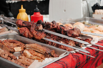 Roasting juicy meat steak with spices in burning charcoals fire on bbq grid