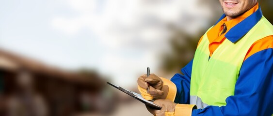 Action of safety officer check on checklist document during safety audit and inspection at drilling...