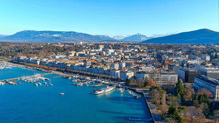 Fototapeta premium Aerial view of Leman lake and Geneva city in Switzerland. The second-most populous Swiss city also one of the world's major centers of international diplomacy. Beautiful drone POV of European place