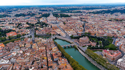 St. Peter's Basilica in Vatican City and Rome city aerial skyline in Italy feat. beautiful old cityscape of European Roma drone point of view with famous historical landmarks along River Tiber