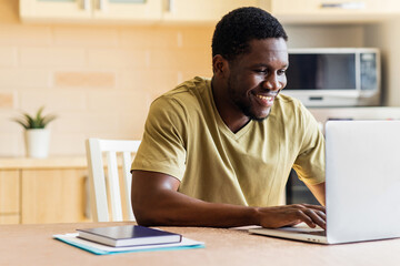 latin hispanic man freelancer using laptop studying online working from home