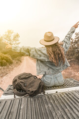 Traveling girl with straw hat and jeans