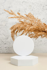 Aesthetic geometric podium with dry pampas grass, minimal background for cosmetic and product...