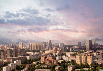 Fototapeta na wymiar Aerial view of center of Moscow against the background of a romantic evening sky with clouds and rays of the sun, Russia