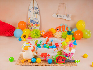 Obraz premium toddler baby photo session in a photo studio with a bubble swimming pool