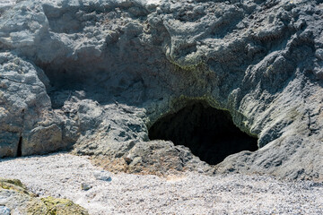 vent of a volcanic fumarole in the ground, covered with crystalline sulfur