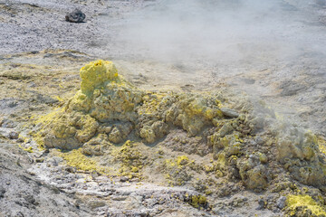 smoking solfatara in a fumarole field on the slope of the Mendeleev volcano