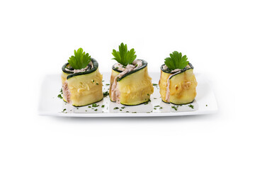 Grilled zucchini rolls stuffed with cream cheese and tuna isolated on white background