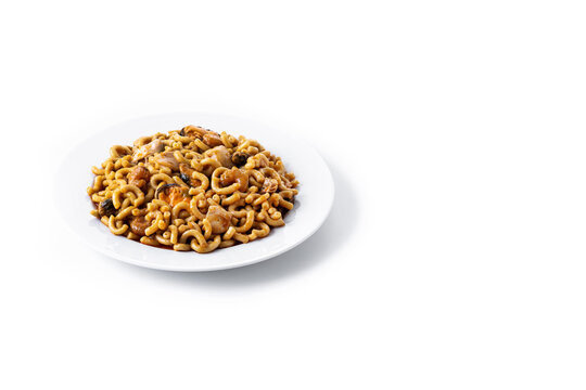Traditional Spanish fideua. Noodle paella isolated on white background