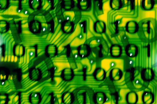 Binary code superimposed on a circuit board
