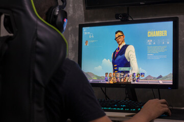 Santos, Brazil - September 7, 2022: Gamer man playing Valorant video game on PC. Valorant is an...