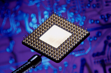 Close-up of a computer chip with a circuit board in the background