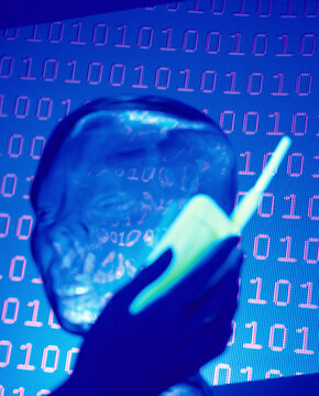 Silhouette of a person holding a mobile phone