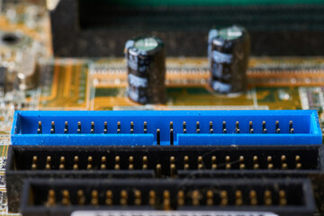 Old motherboard covered in dust and dirt. Close-up.