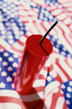 Close-up Of A Firecracker On American Flags